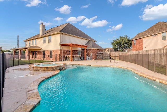 2402 Leslie Ln, Deer Park, TX 77536 - view of swimming pool with a fenced backyard, a patio, a pool with connected hot tub, and a pergola