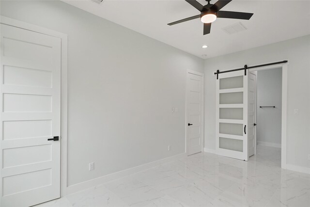 511 Laurel St, La Marque, TX 77568 - unfurnished bedroom with a barn door, baseboards, light marble finish floors, recessed lighting, and ceiling fan