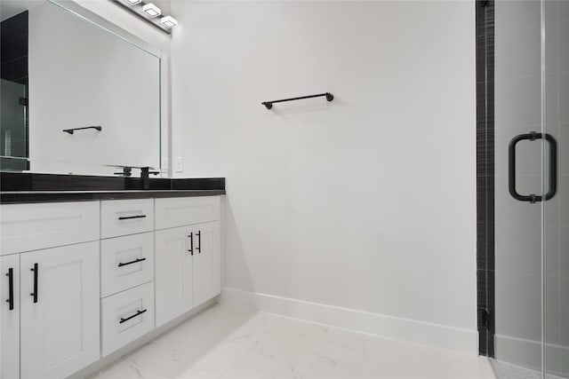 511 Laurel St, La Marque, TX 77568 - full bath featuring marble finish floors, double vanity, baseboards, and a stall shower