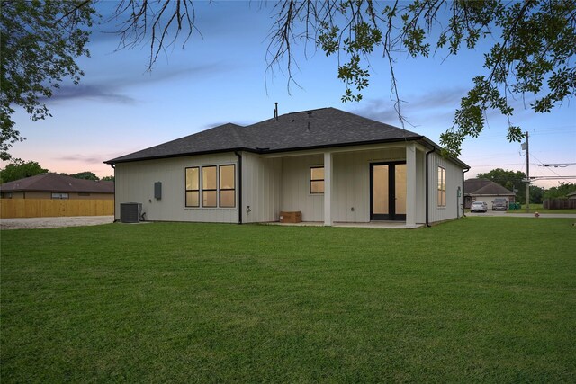 511 Laurel St, La Marque, TX 77568 - back of house with central AC unit and roof with shingles