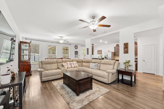 19018 Cicerone Ct, New Caney, TX 77357 - living room with ceiling fan, wood finished floors, and baseboards