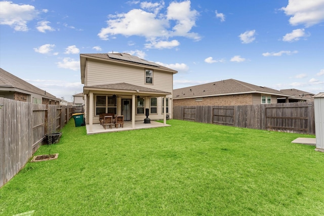 19018 Cicerone Ct, New Caney, TX 77357 - back of property featuring solar panels, a patio area, and ceiling fan