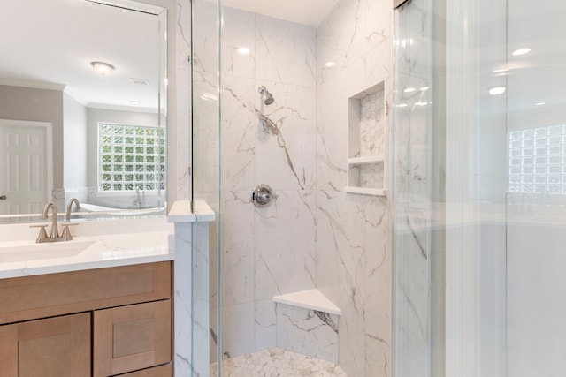 51 N Frosted Pond Dr, The Woodlands, TX 77381 - bathroom with a marble finish shower, vanity, ornamental molding, and tile walls