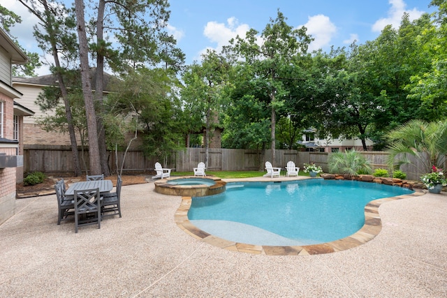 51 N Frosted Pond Dr, The Woodlands, TX 77381 - view of swimming pool featuring a patio area, a fenced backyard, and a pool with connected hot tub