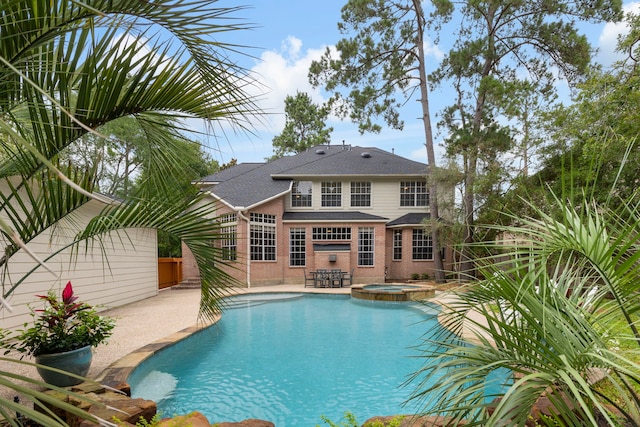 51 N Frosted Pond Dr, The Woodlands, TX 77381 - view of swimming pool with a patio and a pool with connected hot tub