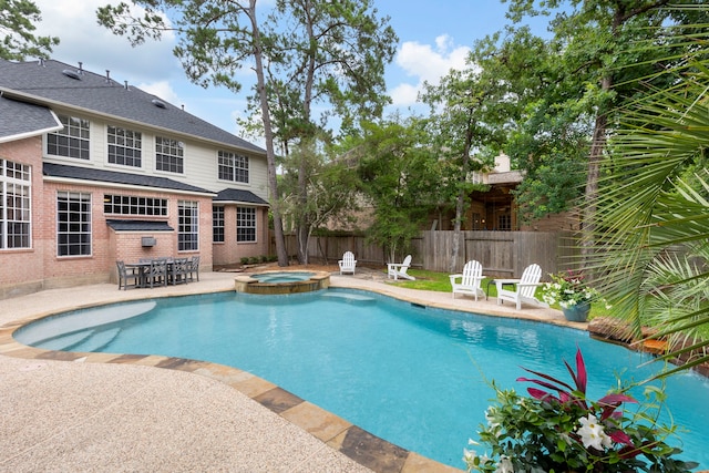 51 N Frosted Pond Dr, The Woodlands, TX 77381 - view of swimming pool with a patio and a pool with connected hot tub