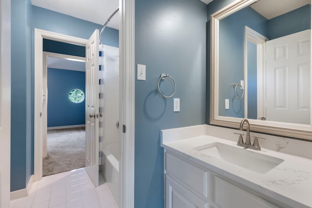51 N Frosted Pond Dr, The Woodlands, TX 77381 - full bath featuring vanity, tile patterned floors, baseboards, and shower / washtub combination