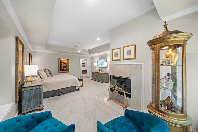 14211 Manderly Dr, Houston, TX 77077 - carpeted bedroom featuring crown molding, a tile fireplace, a tray ceiling, and recessed lighting