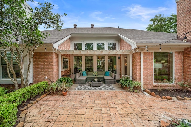 14211 Manderly Dr, Houston, TX 77077 - view of exterior entry featuring an outdoor hangout area, a pergola, brick siding, a patio, and a shingled roof