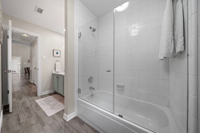 14211 Manderly Dr, Houston, TX 77077 - full bathroom with washtub / shower combination, vanity, baseboards, and wood tiled floors