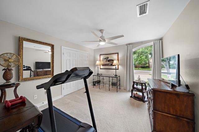 14211 Manderly Dr, Houston, TX 77077 - exercise area with a ceiling fan, carpet flooring, and baseboards