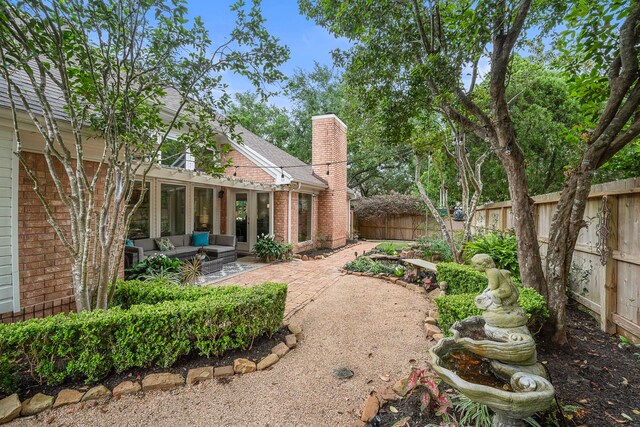 14211 Manderly Dr, Houston, TX 77077 - fenced backyard featuring outdoor lounge area and a patio area