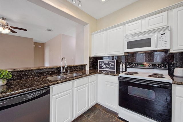 16315 Redbud Berry Ln, Cypress, TX 77433 - kitchen featuring electric range, white microwave, stainless steel dishwasher, a sink, and dark stone counters