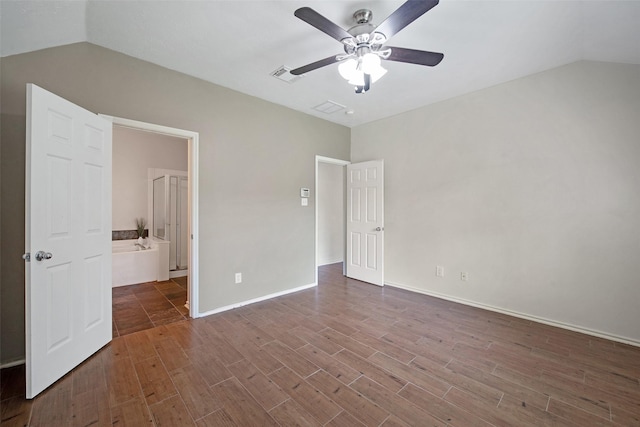 16315 Redbud Berry Ln, Cypress, TX 77433 - unfurnished bedroom featuring lofted ceiling, dark wood finished floors, baseboards, a ceiling fan, and ensuite bathroom