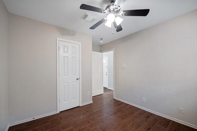 16315 Redbud Berry Ln, Cypress, TX 77433 - unfurnished bedroom with dark wood-style floors, baseboards, and a ceiling fan