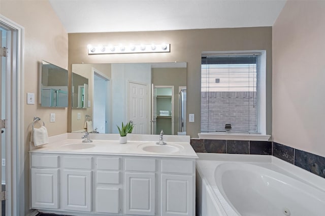 16315 Redbud Berry Ln, Cypress, TX 77433 - bathroom featuring double vanity and a whirlpool tub