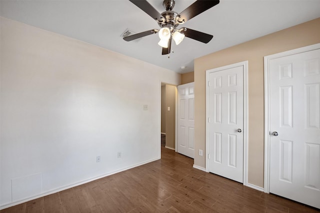 16315 Redbud Berry Ln, Cypress, TX 77433 - unfurnished bedroom featuring dark wood-style flooring, baseboards, and a ceiling fan