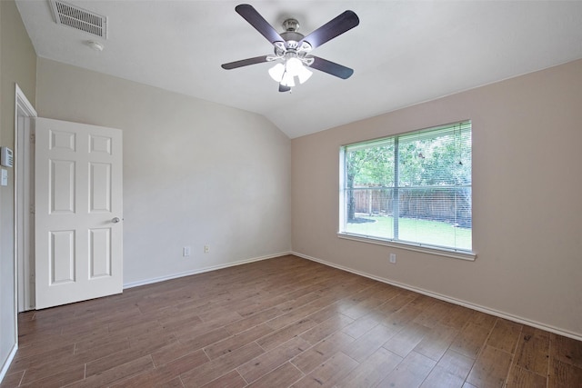 16315 Redbud Berry Ln, Cypress, TX 77433 - empty room featuring wood finished floors, lofted ceiling, ceiling fan, and baseboards