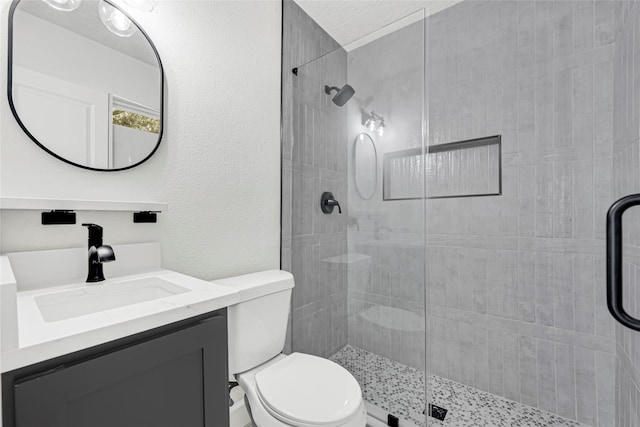 3910 Cetti St, Houston, TX 77009 - full bath with toilet, vanity, a shower stall, and a textured wall