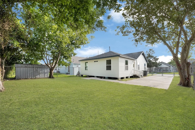 3910 Cetti St, Houston, TX 77009 - rear view of property featuring roof with shingles and central AC