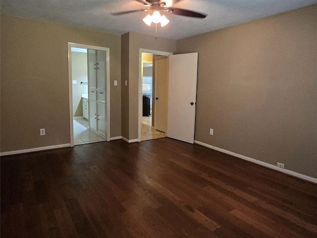20339 Acapulco Cove Dr, Humble, TX 77346 - unfurnished bedroom featuring wood finished floors, baseboards, ensuite bath, and a ceiling fan