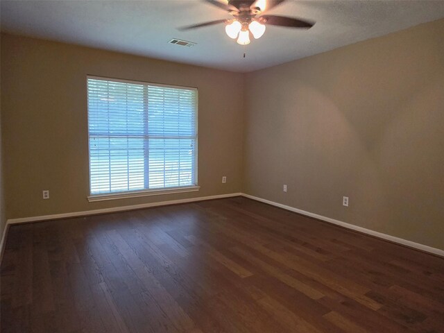 20339 Acapulco Cove Dr, Humble, TX 77346 - unfurnished room with dark wood-style flooring, baseboards, and a ceiling fan