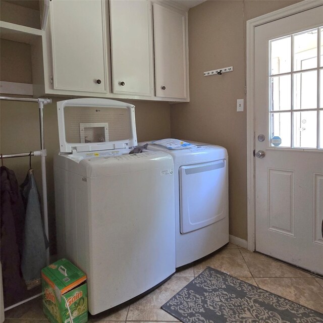 20339 Acapulco Cove Dr, Humble, TX 77346 - laundry area featuring separate washer and dryer, cabinet space, and light tile patterned floors