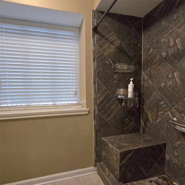20339 Acapulco Cove Dr, Humble, TX 77346 - full bath with a tile shower, tile patterned floors, and baseboards