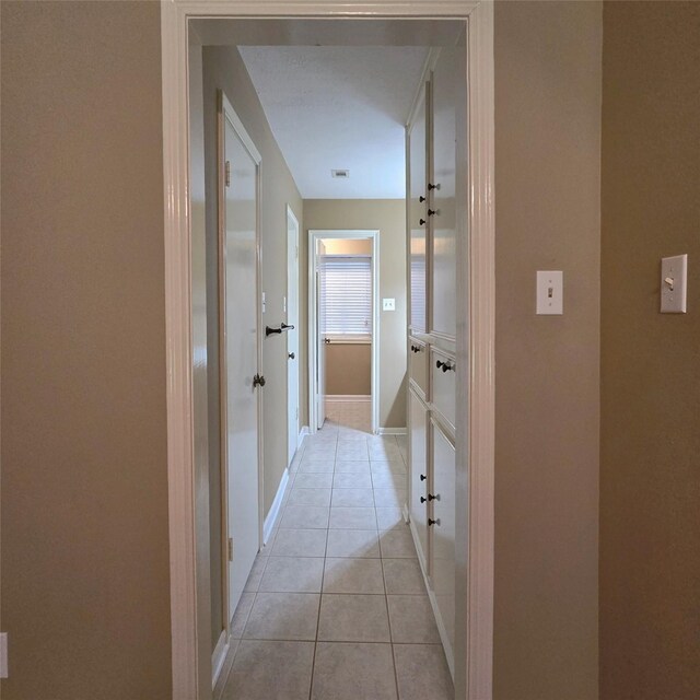 20339 Acapulco Cove Dr, Humble, TX 77346 - hallway with light tile patterned flooring and baseboards