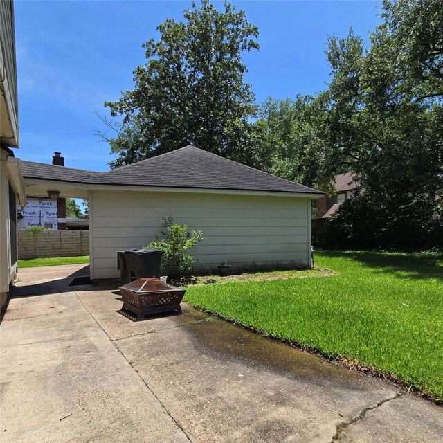 20339 Acapulco Cove Dr, Humble, TX 77346 - view of home's exterior featuring a patio area and an outdoor fire pit