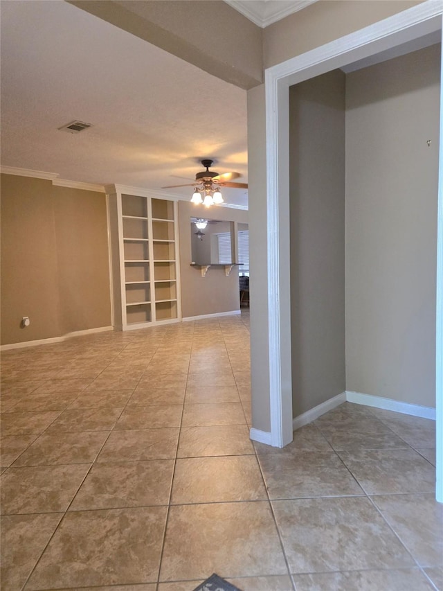 20339 Acapulco Cove Dr, Humble, TX 77346 - tiled empty room with built in features, ornamental molding, baseboards, and a ceiling fan