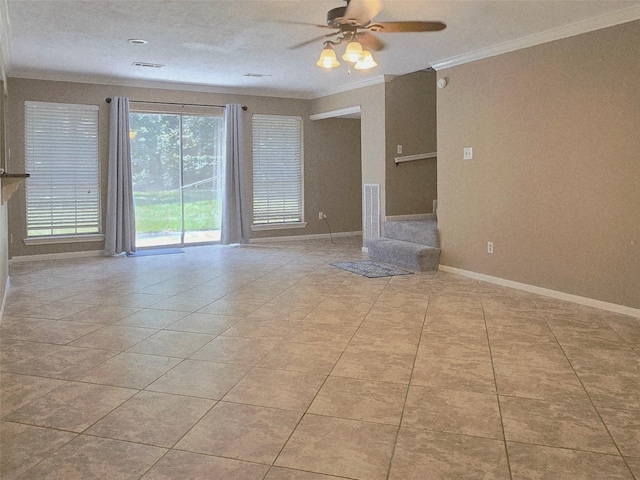20339 Acapulco Cove Dr, Humble, TX 77346 - unfurnished living room with crown molding, tile patterned flooring, ceiling fan, and baseboards