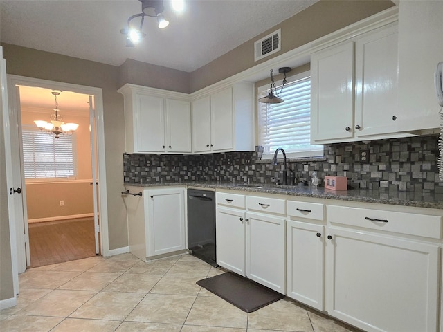 20339 Acapulco Cove Dr, Humble, TX 77346 - kitchen featuring dishwasher, a chandelier, a sink, tasteful backsplash, and white cabinets