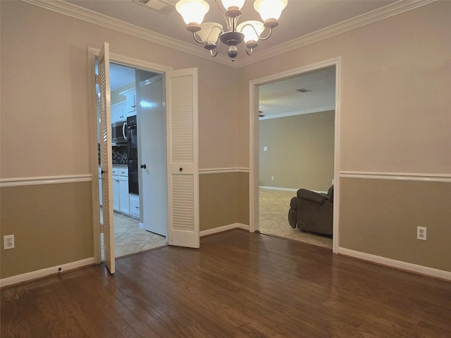 20339 Acapulco Cove Dr, Humble, TX 77346 - spare room featuring a chandelier, wood finished floors, crown molding, and baseboards