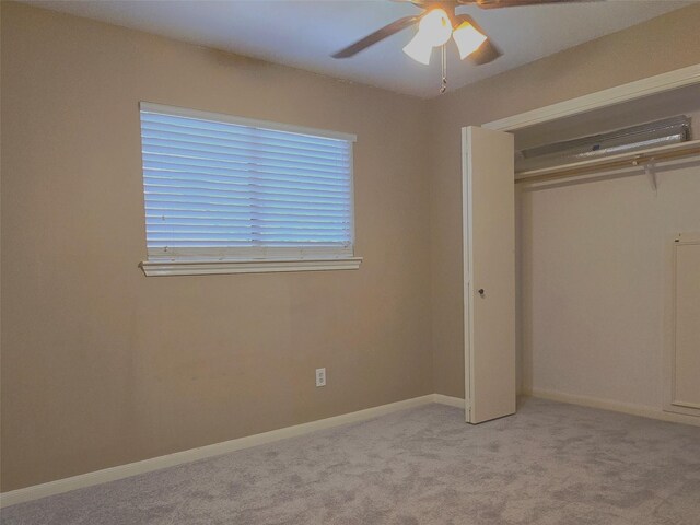 20339 Acapulco Cove Dr, Humble, TX 77346 - unfurnished bedroom featuring a closet, light carpet, ceiling fan, and baseboards
