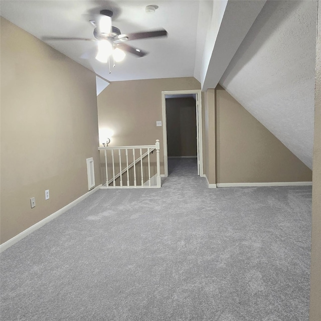 20339 Acapulco Cove Dr, Humble, TX 77346 - additional living space with vaulted ceiling, a ceiling fan, carpet flooring, and baseboards