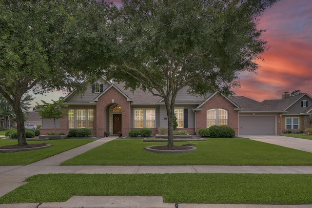 2103 Gaylin Hills Ct, Spring, TX 77386 - view of front of house featuring brick siding, driveway, an attached garage, and a front yard