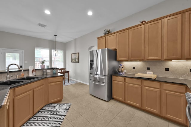 2103 Gaylin Hills Ct, Spring, TX 77386 - kitchen with stainless steel fridge, tasteful backsplash, dark countertops, recessed lighting, and light tile patterned flooring
