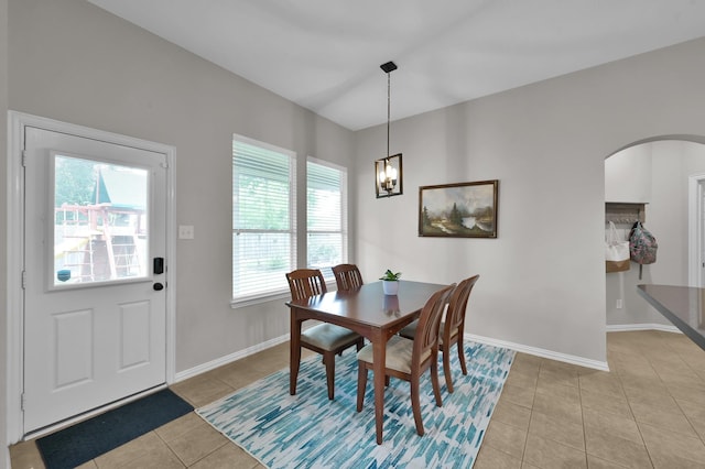 2103 Gaylin Hills Ct, Spring, TX 77386 - dining space with plenty of natural light, light tile patterned flooring, arched walkways, and a chandelier