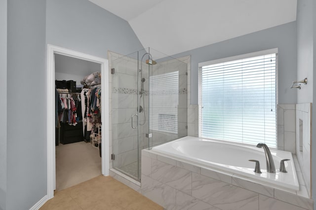 2103 Gaylin Hills Ct, Spring, TX 77386 - bathroom with a bath, a shower stall, a walk in closet, vaulted ceiling, and tile patterned floors