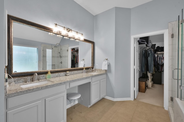 2103 Gaylin Hills Ct, Spring, TX 77386 - bathroom featuring a spacious closet, double vanity, a stall shower, and tile patterned flooring