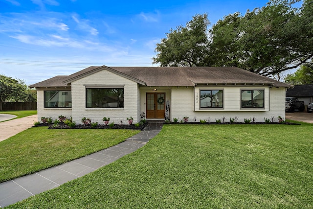 1902 Knoboak Cir, Houston, TX 77080 - ranch-style home featuring brick siding, a front yard, and roof with shingles