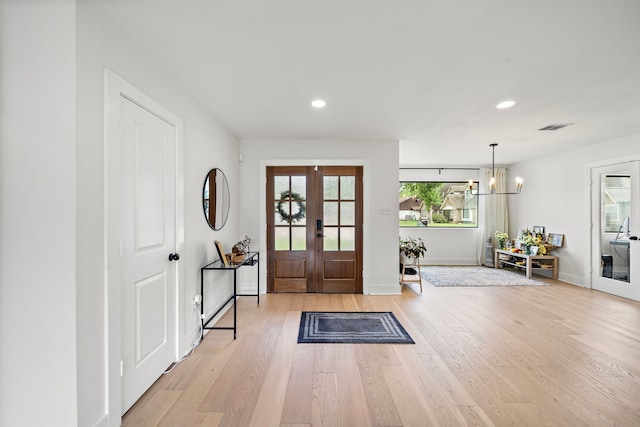 1902 Knoboak Cir, Houston, TX 77080 - entryway with french doors, baseboards, light wood-style floors, recessed lighting, and a chandelier