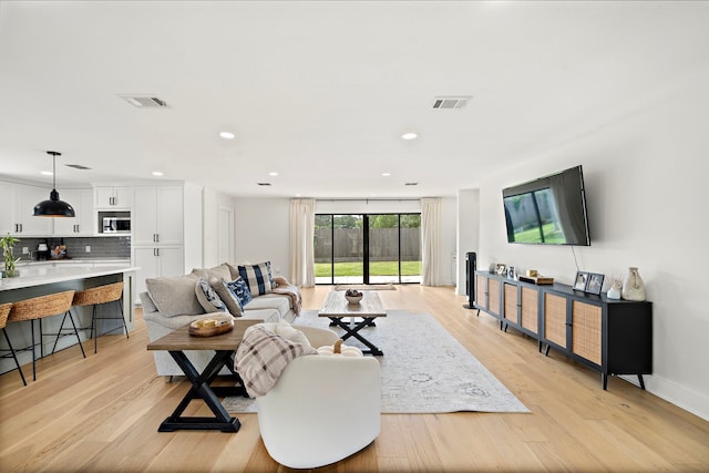 1902 Knoboak Cir, Houston, TX 77080 - living room featuring light wood finished floors and recessed lighting