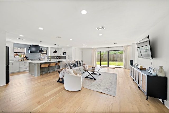 1902 Knoboak Cir, Houston, TX 77080 - living room with plenty of natural light, light wood-type flooring, and recessed lighting