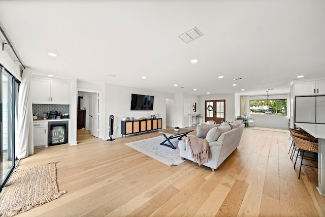 1902 Knoboak Cir, Houston, TX 77080 - living area with recessed lighting, wine cooler, light wood-style flooring, and baseboards