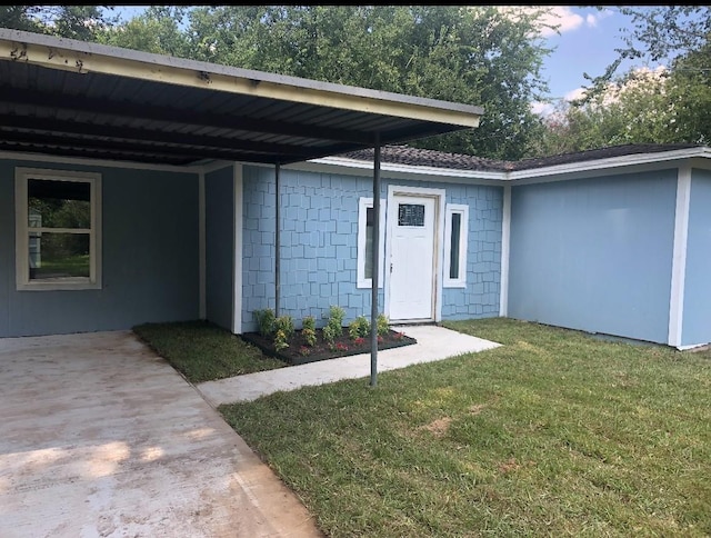 5223 Windemere St, Houston, TX 77033 - entrance to property with a lawn, a shingled roof, and an attached carport