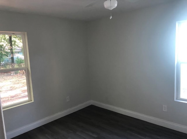 5223 Windemere St, Houston, TX 77033 - spare room with dark wood-style flooring, a ceiling fan, and baseboards