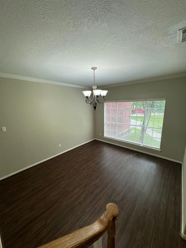 2232 Stableridge Dr, Conroe, TX 77384 - empty room featuring a chandelier, ornamental molding, dark wood-style flooring, baseboards, and a textured ceiling