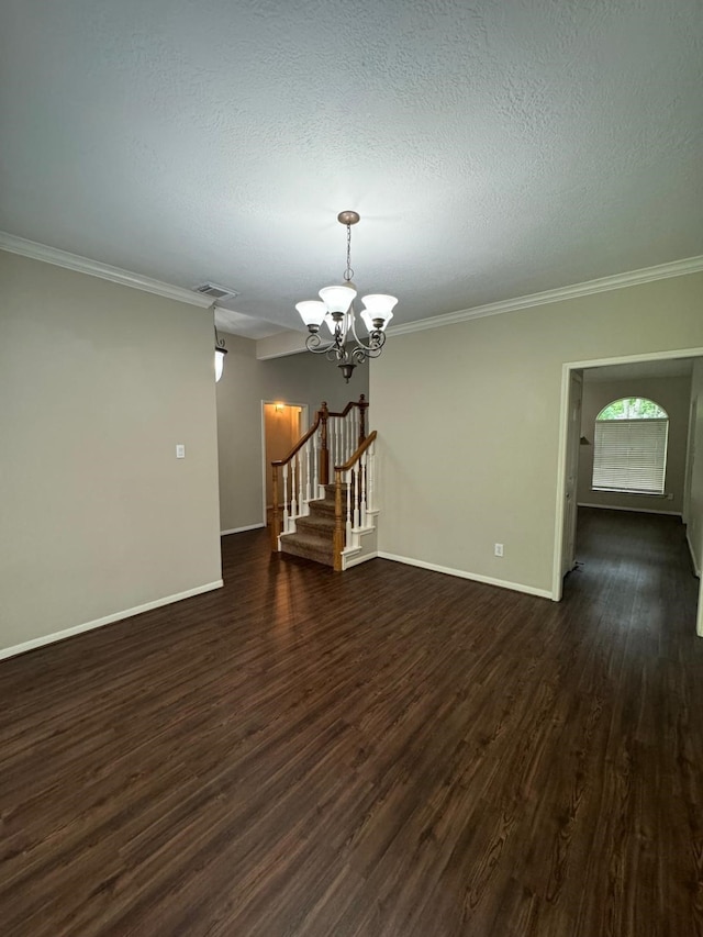 2232 Stableridge Dr, Conroe, TX 77384 - spare room with a chandelier, dark wood-style floors, stairs, baseboards, and crown molding